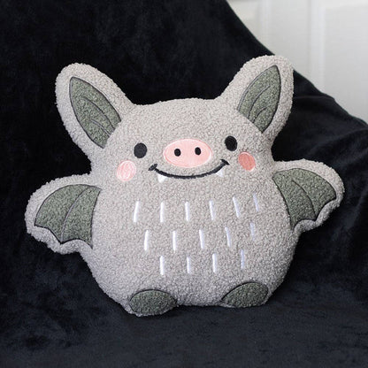 Coussin chauve-souris mignon en bouclé